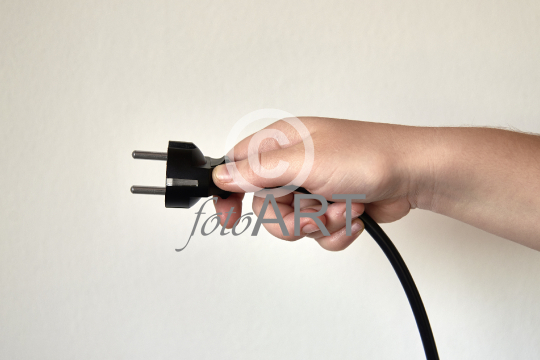 Power plug in a hand